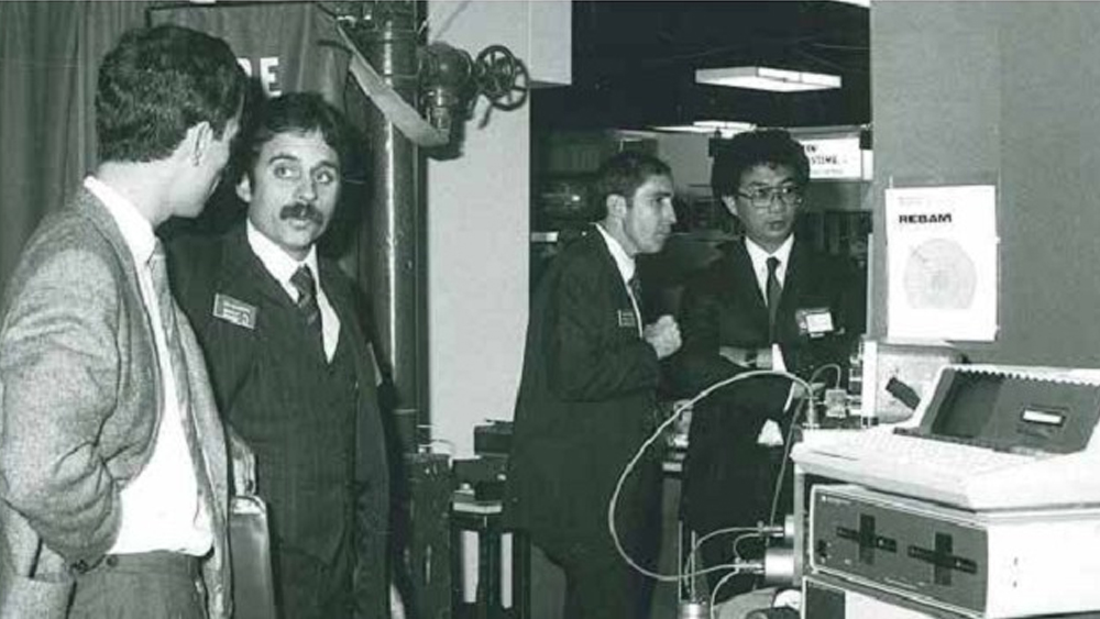Black and white photo of four male participants at the Turbo Machinery Lab's first symposium.
