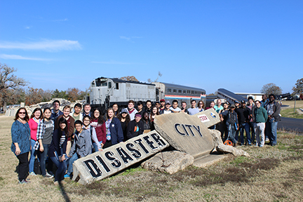 Group photo in front of Disaster City sign.