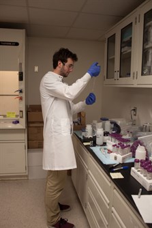 NSSPI researchers examining in a lab.