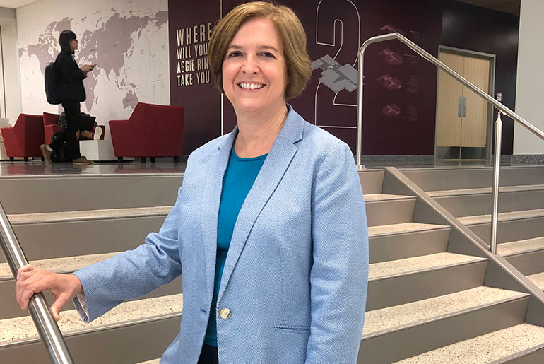 Dr. Katherine Banks standing in the second floor of the Zachry Engineering Education Complex
