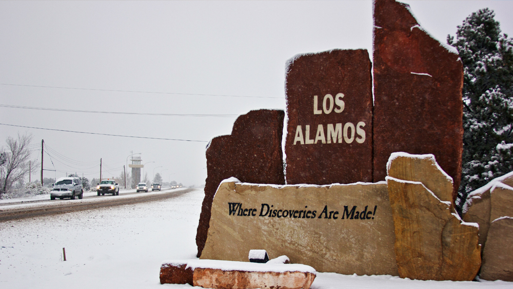 Photo of Los Alamos National Laboratory sign covered in snow.