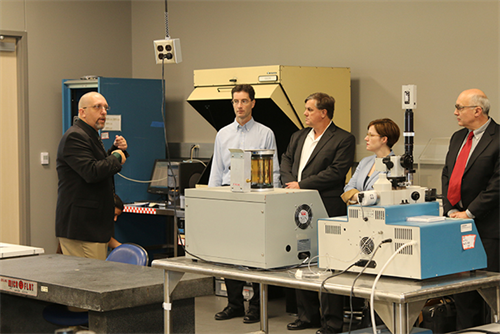 Dr. Rusty Harris (far left), associate professor in the Department of Electrical and Computer Engineering, gave board members a tour of the labs within the Giesecke Building.