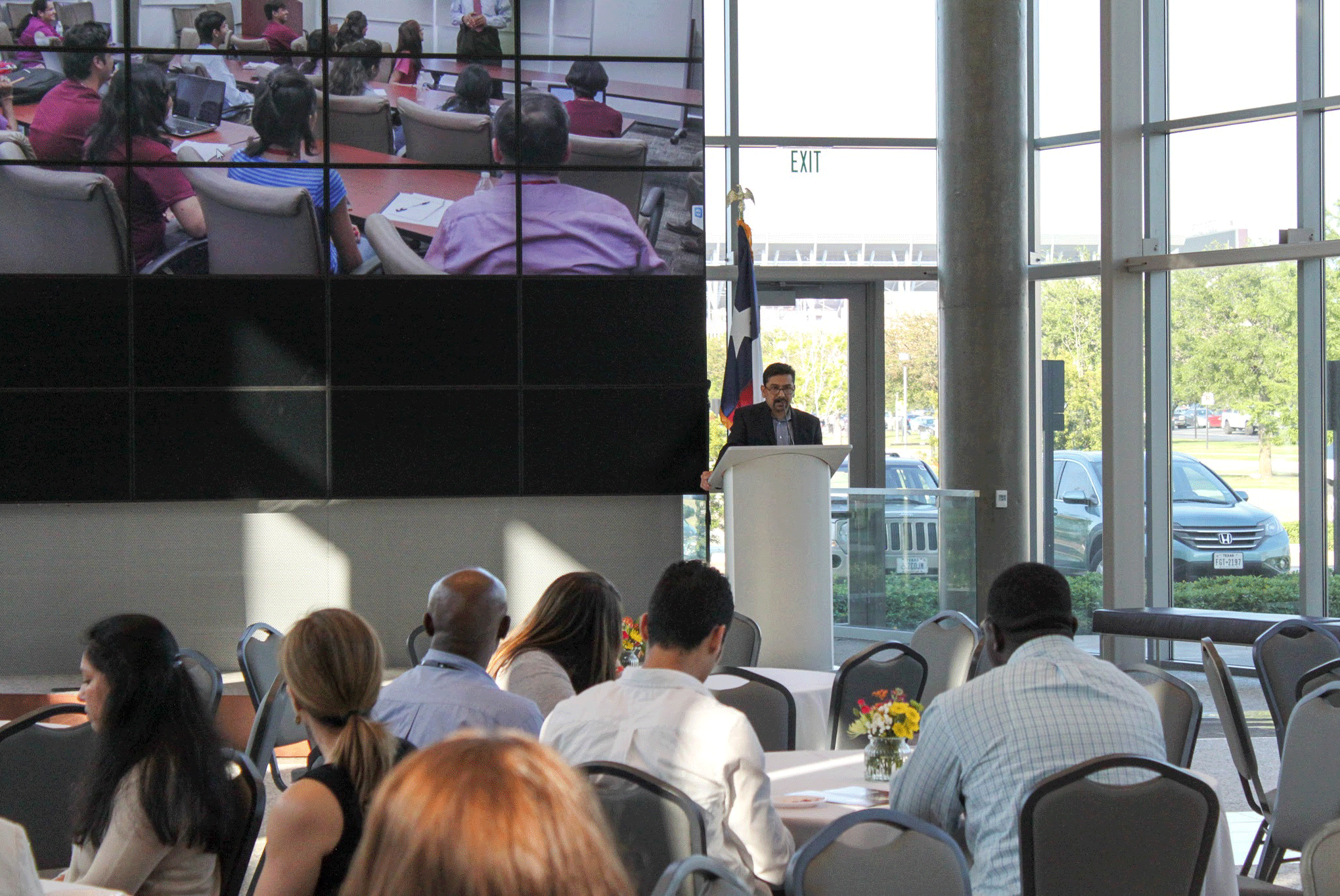 The Nuclear Security Science and Policy Institute Representative Giving A Speech In Front of An Audience