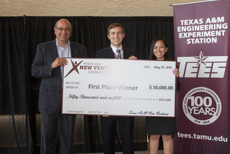 REEcycle Being Awarded A Check With Words of Texas A&M New Ventures Competition First Place Winner 50,000.00 Fifty Thousand and no/100 Dollars