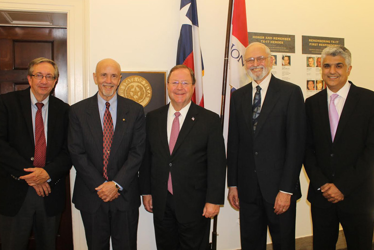 Group photo with Mark Andrews, U.S. Rep. Bill Flores; Claridge and Dr. Balakrishna Haridas and two other men.