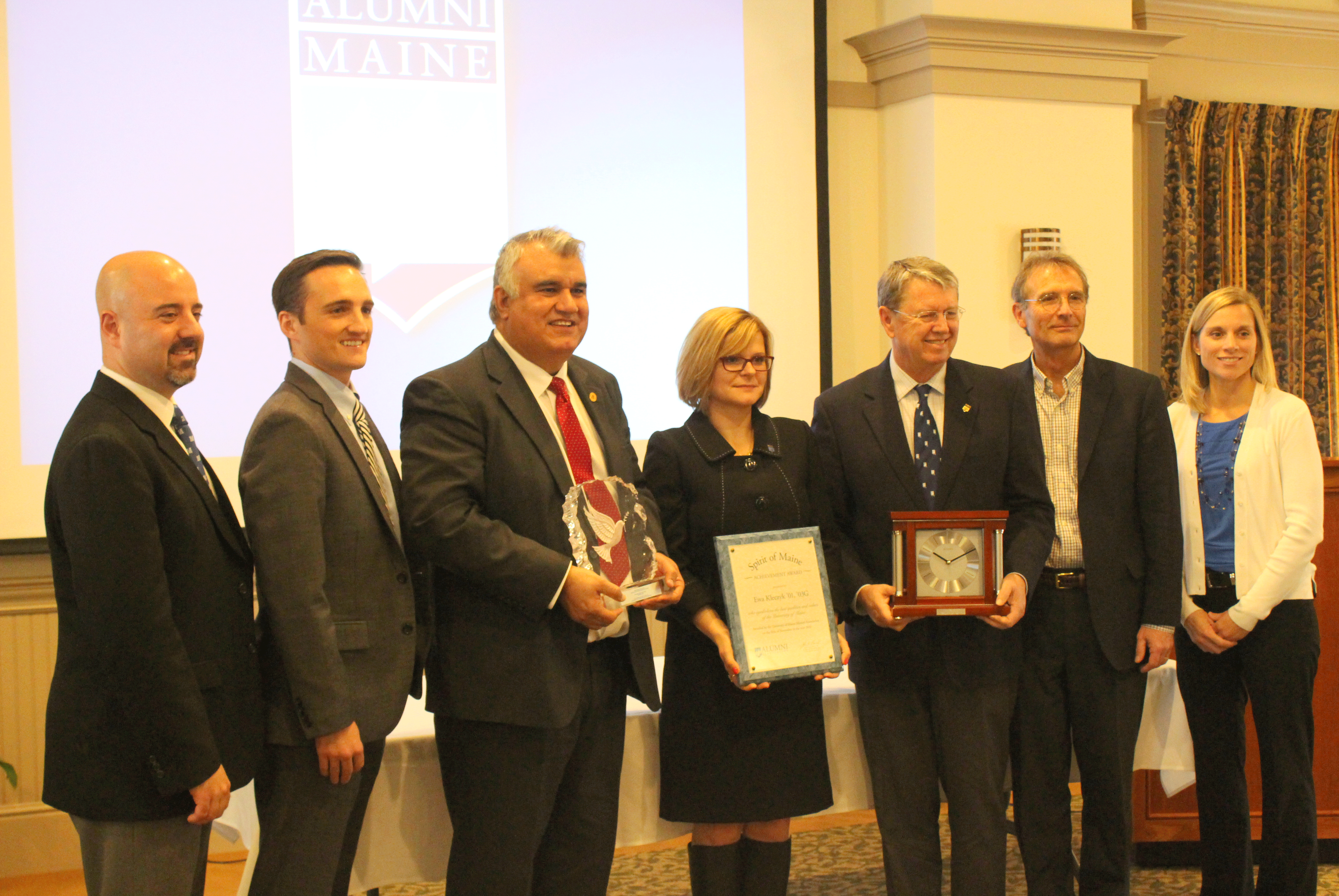 Dr. Mian Riaz (third from left) accepts his award during a ceremony hosted by the University of Maine Alumni Association.