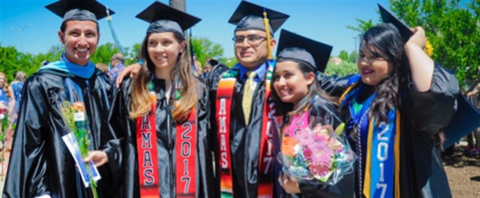 Group of hispanic students during graduation.