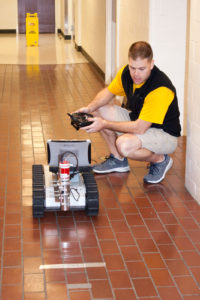 A person operating a RC rover