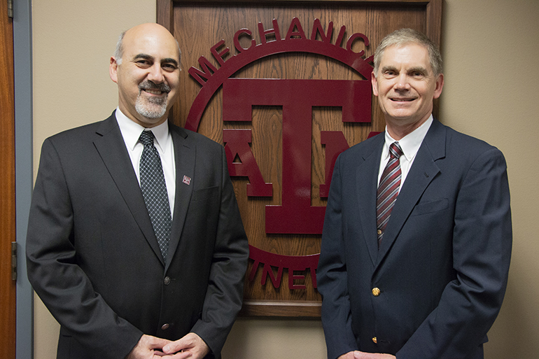 Dr. Andreas A. Polycarpou and Quentin Baker standing in front of A&amp;M Mechanical Engineering sign.