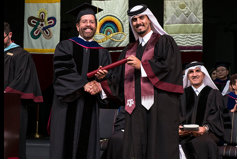 Texas A&M at Qatar dean Dr. César O. Malavé with the 900th graduate, Abdulaziz Al-Qahtani
