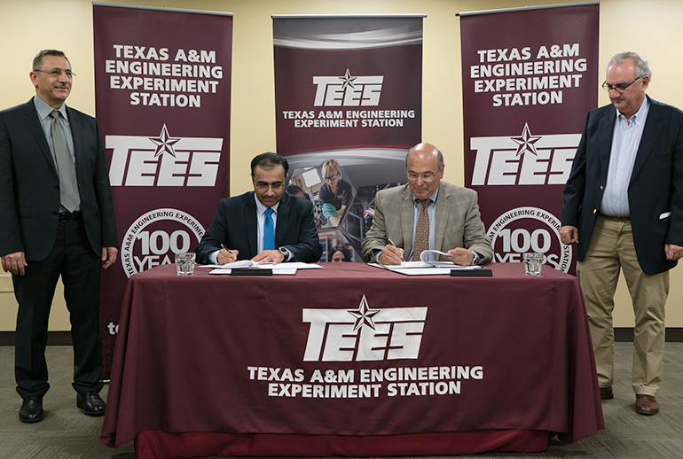 The Qatar General Electricity and Water Corporation signing a collaborative research agreement with the Texas A&amp;M Engineering Experiment Station (TEES) Smart Grid Center.