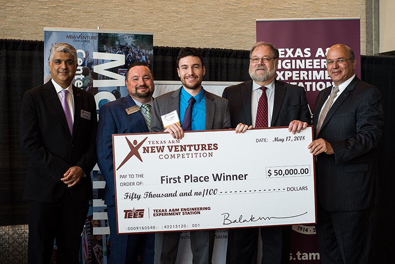 Group photo of TNVC leaders and the first place winner, Spontaneous Pop-Up Display, holding a giant $50,000 check.
