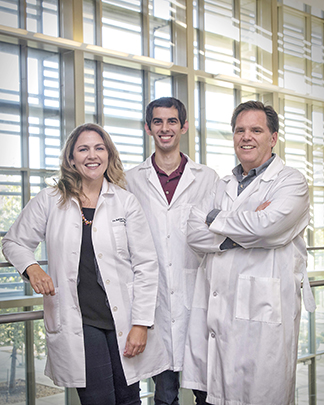 Dr. Ashley Saunders, Dr. Mark Wierzbicki and Dr. Duncan Maitland posing for a picture