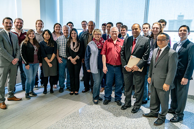 Group photo with Holly Frost and Kathaleen Wall and Texas A&amp;M students and faculty.