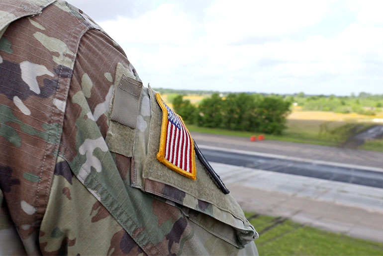 US soldier's army uniform with American flag.