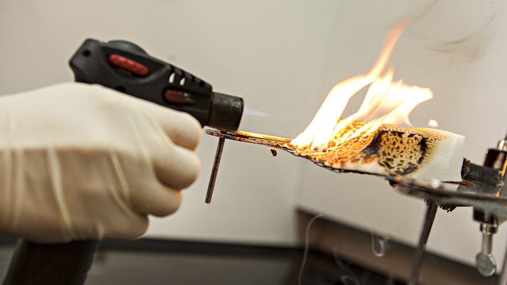Testing fire retardant foam in Dr. Jaime Grunlan's lab