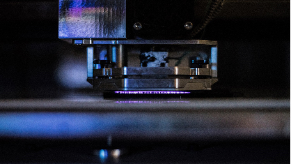 A close-up view of the printing technology developed by Dr. Micah Green and his collaborators at Essentium, Inc.