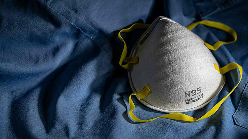N95 respirator against a blue background.