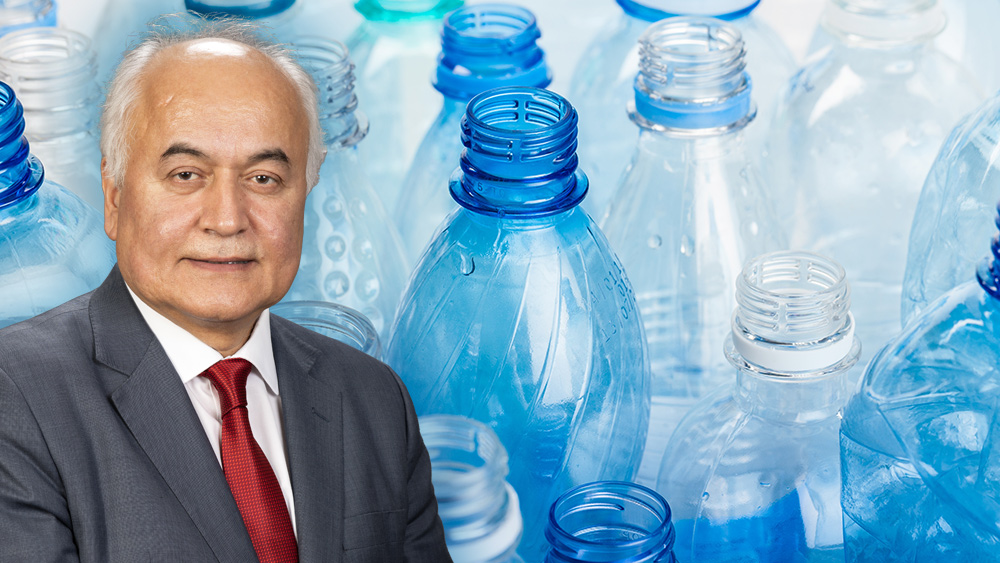Dr. Ali Erdemir in front of plastic water bottles
