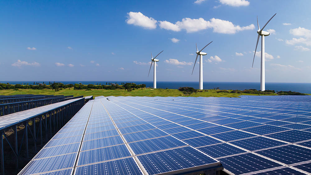 Solar panels and wind turbines generating power