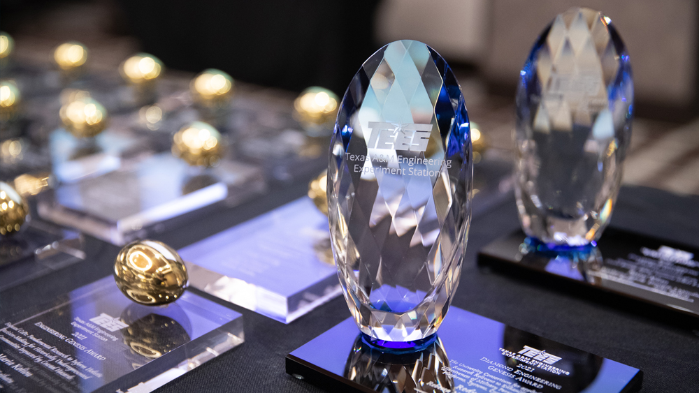 golden and diamond egg award trophies arranged on a table
