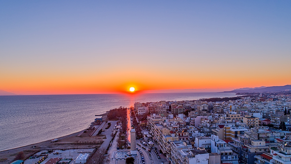 Aerial shot of the northern Greek city of Alexandroupolis with the lighthouse under a winter sunset. 